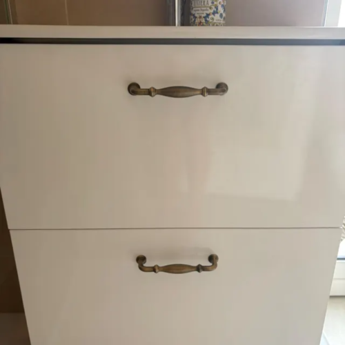 Jennifer's customer photo of antique brass cabinet pulls