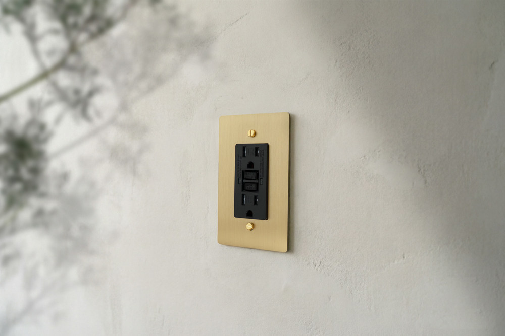 1 Gang GFCI Outlet — Supplier room illustration — Brass plate, Brass screws, Black plastic
